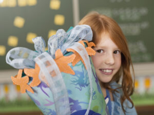 Girl holding school cone